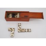 Boxed Victorian bone and ebony dominoes, the pieces 36 mm
