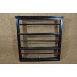 An ebonized dresser back / plate rack, 93 cm x 95 cm high