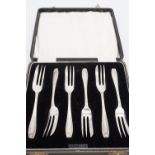 A cased set of six George V silver pastry forks, each stem framed by a fine bell-flower swag, Arthur