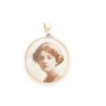 An early 20th Century yellow metal double-faced pendant locket, stamped 9ct and tested as gold, 4 cm