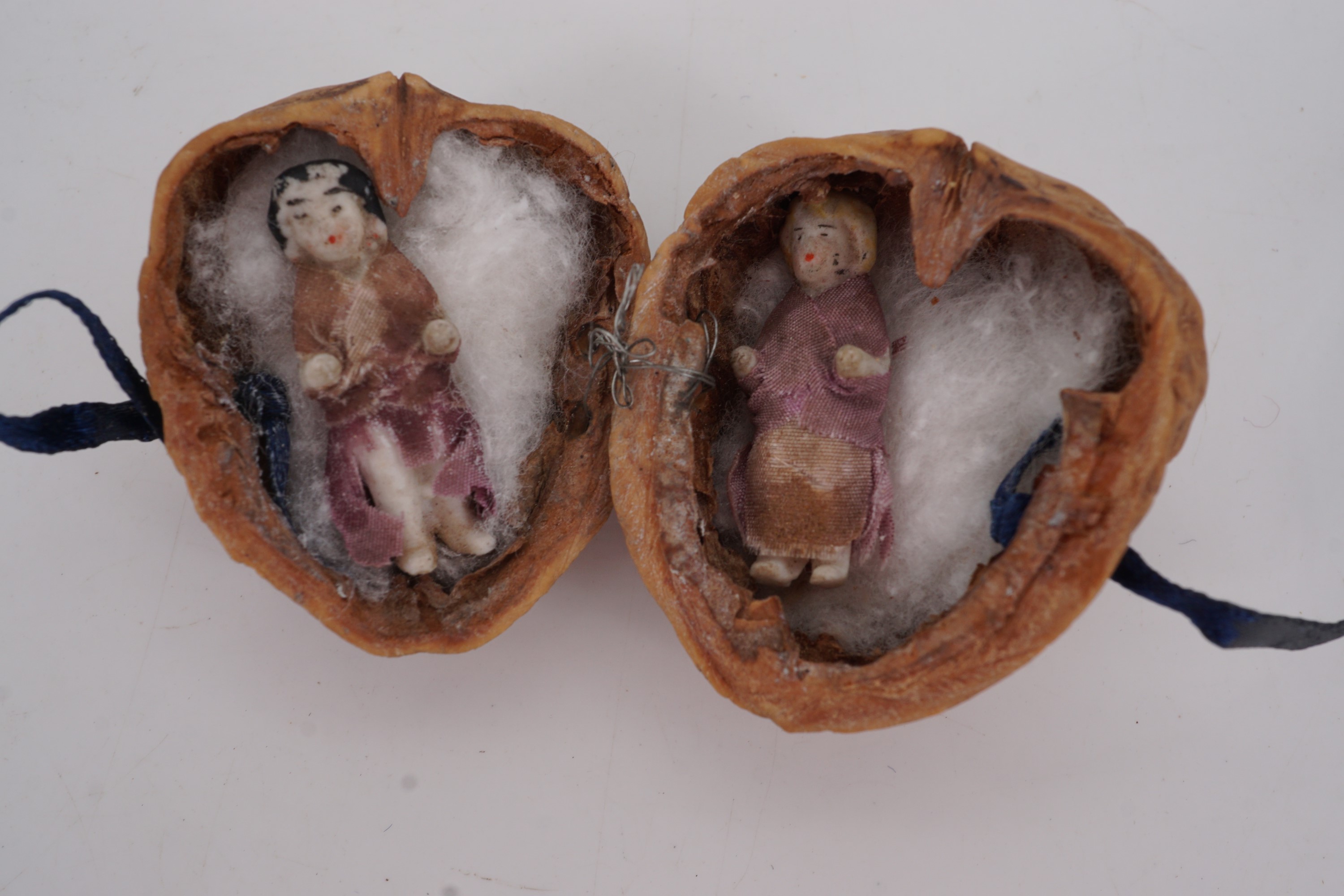 A walnut shell containing two 19th Century miniature porcelain dolls - Image 2 of 2