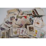 A large quantity of late 19th Century and other postcards and greetings cards etc