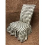 An early 20th Century checked fabric upholstered boudoir chair