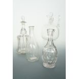 A Georgian glass decanter of Indian club form, a Victorian claret jug, ribbed-bell decanter and