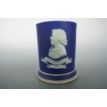 A 1906 Wedgwood jasperware match pot or spill vase, bearing a profile portrait of Josiah Wedgwood