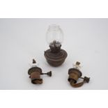 A small oil lamp and parts