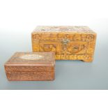 An oriental carved wooden box, 25 x 14 x 13 cm and one other box, 15 x 10 x 6 cm