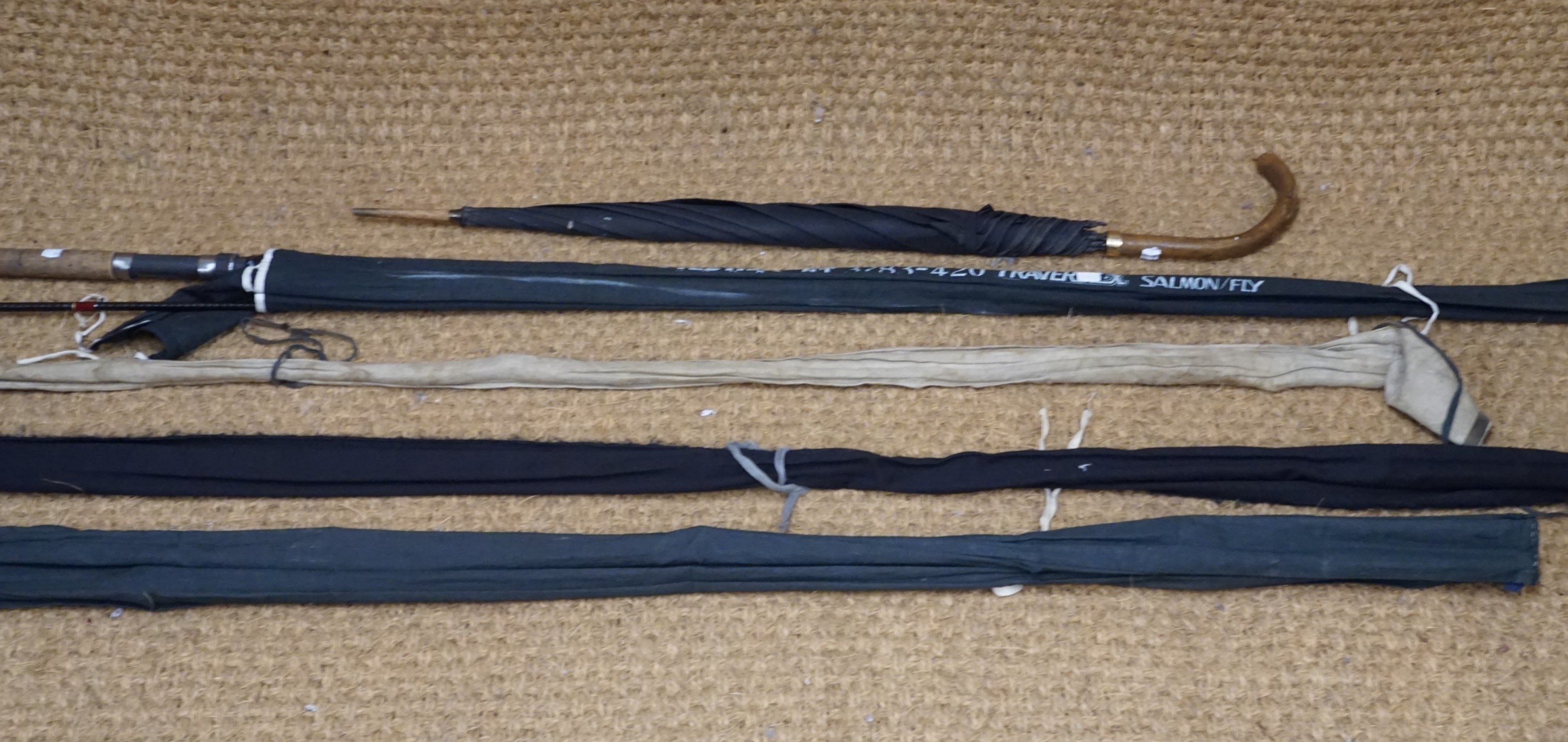 Four various fishing rods including 9' greenheart fly rod, an umbrella etc.