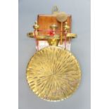 A brass dinner gong
