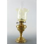 A brass oil lamp, 50 cm high
