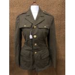 A US army Service Coat together with a pair of cotton trousers