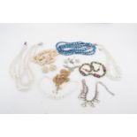 A quantity of vintage costume beads and necklaces etc, including shell and glass lamp-work beads,
