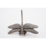 A contemporary pewter pin brooch modelled as a dragonfly, by A R Browne