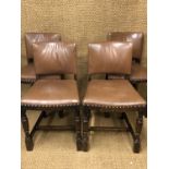 Four 1930s hide upholstered oak dining chairs