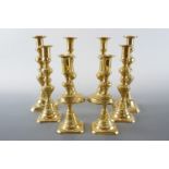 Four pairs of brass candlesticks, tallest two pairs 25 cm