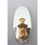 A contemporary mirror / candle sconce