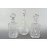 Three cut glass decanters