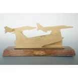A "trench art" brass letter rack in the form of silhouetted RAF Lightning and other jet aircraft,