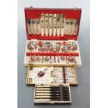 A boxed cutlery set, cased dessert forks and butter knives