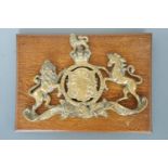 A cast brass Victorian Royal Arms plaque, 31 x 23 cm