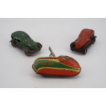 A clockwork toy car and two other German tinplate cars