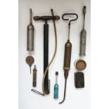 Vintage tools including a pump, grease guns, a Carborundum valve grinding compound tin etc