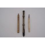 A Victorian slide pen / pencil, one other propelling pencil and a bodkin