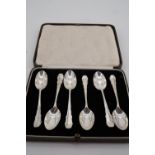 A cased set of six George V silver tea spoons, each having a thread-bordered stem with elaborately
