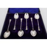 Six Victorian silver tea spoons, each having a slender twisted stem and flamboyant Rococo