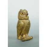 A Victorian lacquered brass novelty go-to-bed or vesta case modelled as an owl, having inset glass