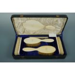 A Victorian cased ivory dressing table set