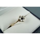 A blue and white stone flowerhead cluster ring, the stones claw-set of a 9 ct gold shank, 7 mm, N