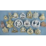 A quantity of Canadian cap badges etc