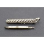 A Victorian silver pocket folding knife and button hook, having gadrooned or cabled grip scales, the
