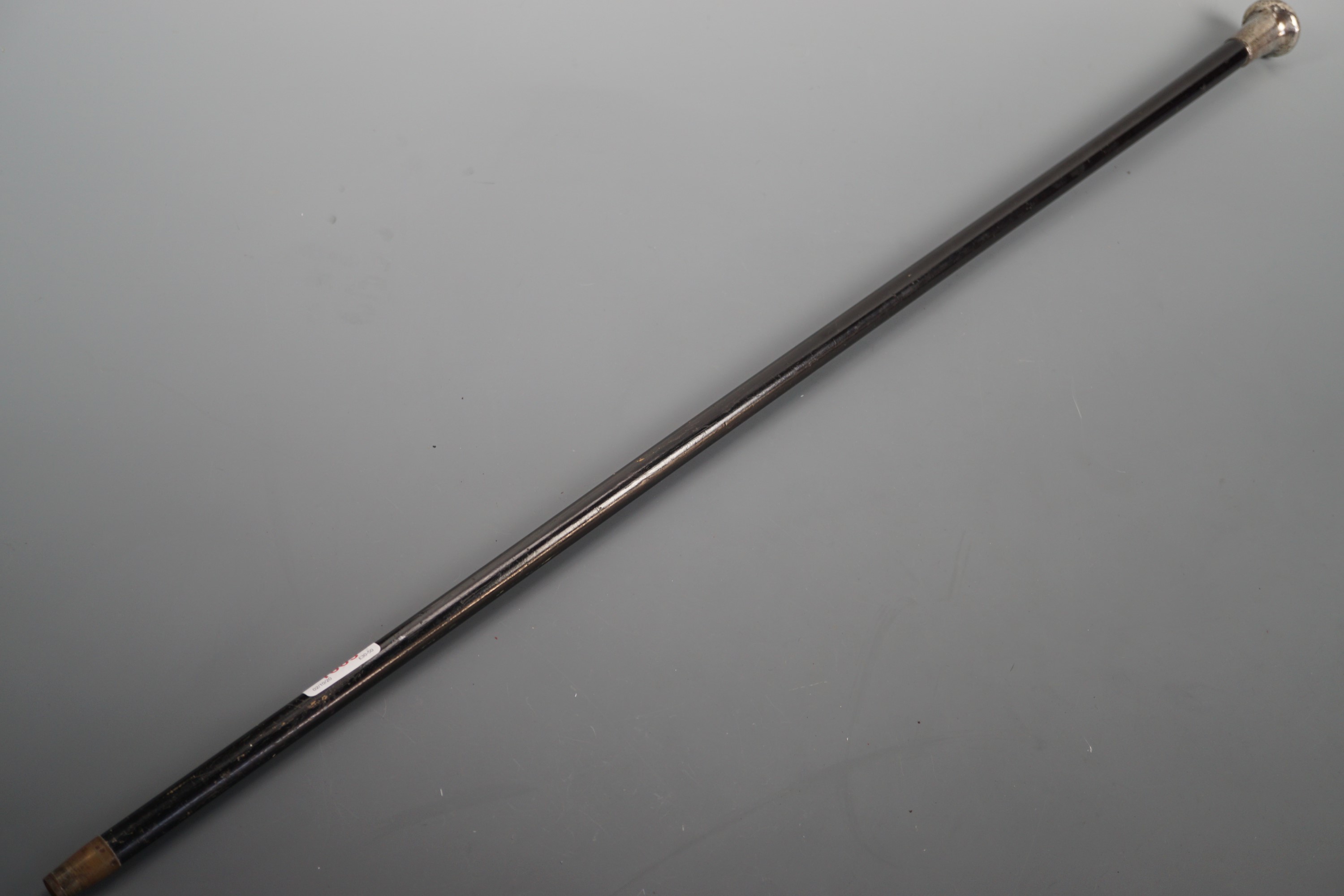 A gentleman's silver mounted ebonized evening cane, the pommel wriggle-work and engraved with