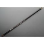 A gentleman's silver mounted ebonized evening cane, the pommel wriggle-work and engraved with