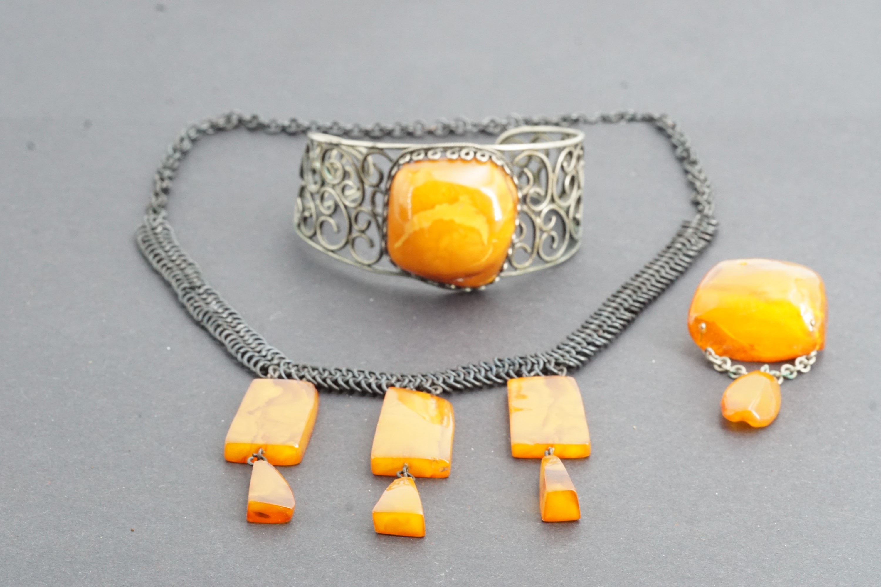 Latvian amber jewellery, including a base metal bangle with large amber nodule, a conforming pendant - Image 3 of 3