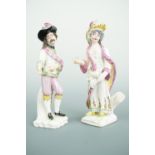 A pair of Mennecy porcelain figures modelled as actors in theatrical dress, bearing incised Duché de