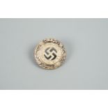 An early German Third Reich NSDP Deutschland Erwache lapel badge