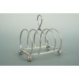 An Edwardian silver toast rack, of diminutive stature, Sydney Thomas Steel, Birmingham, 1906, 43.4g