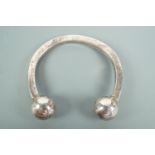 A child's silver torc bangle, approx 4 cm