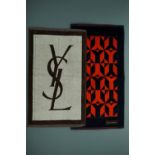 Two Yves Saint Laurent travel hand towels, each 36 x 68 cm