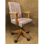 A contemporary pine office swivel chair
