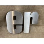 Fifteen large metal letters, tallest 50 cm