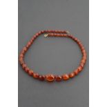 A single strand necklace of graded amber beads, largest 22 x 11mm, smallest 6 x 7mm, 58 cm, 30g