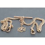 A gentleman's 9ct rose gold double 'Albert' graded watch chain, with swastika pendant charm, 24.6g