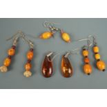 A pair of sun spangled amber teardrop shaped ear pendants together with three pairs of