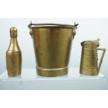 Two novelty brass vesta cases, modelled as a bottle of 'Veuve Cliquot' and a water pitcher, together