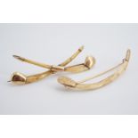 A pair of antique Indian yellow metal mounted bone brooches, 6.5 cm