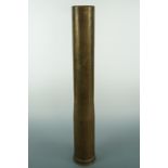 A large brass 90 mm recoilless artillery shell case